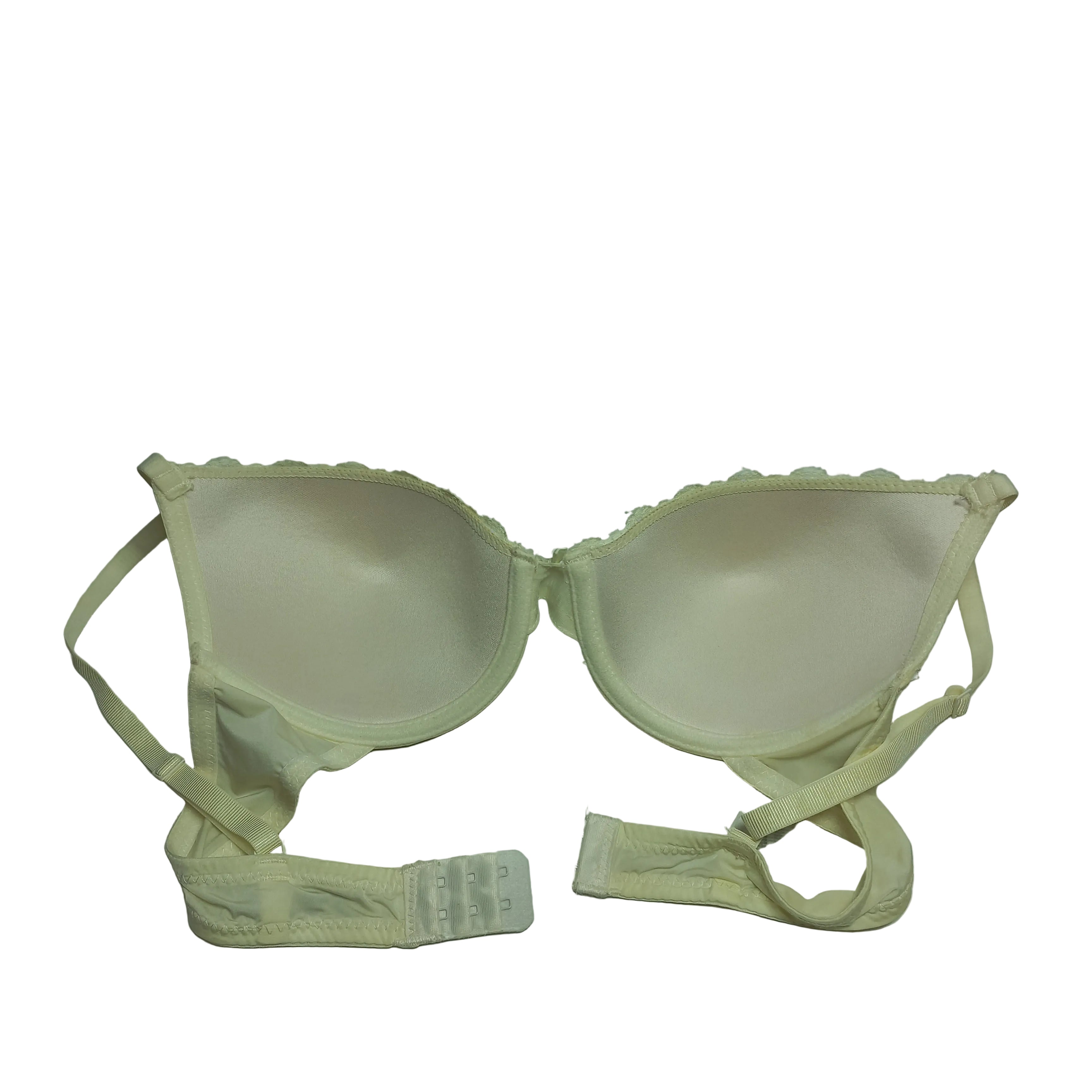 Bra in neutral color displayed on flat surface