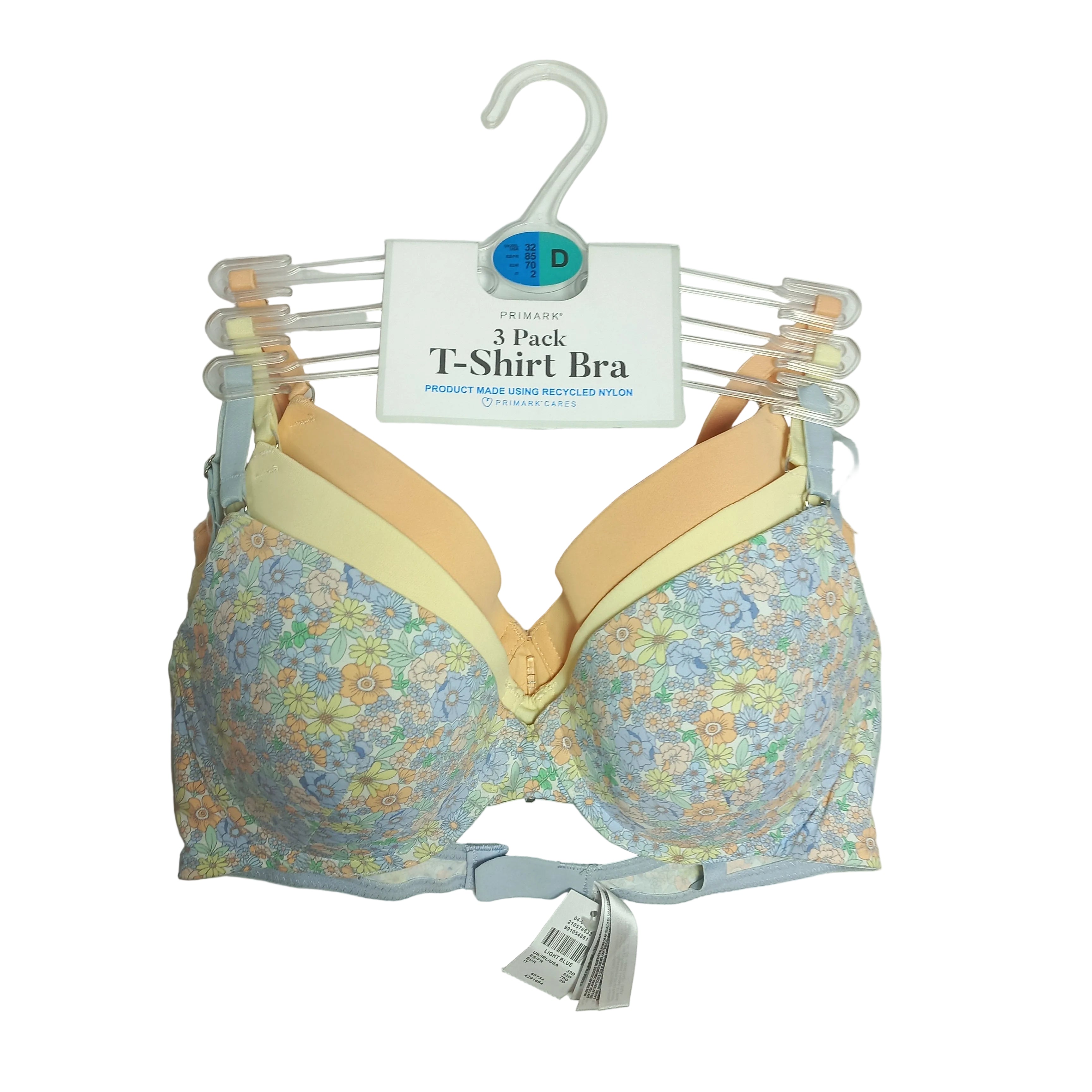 Floral-patterned Primark T shirt bra with packaging on a gray background
