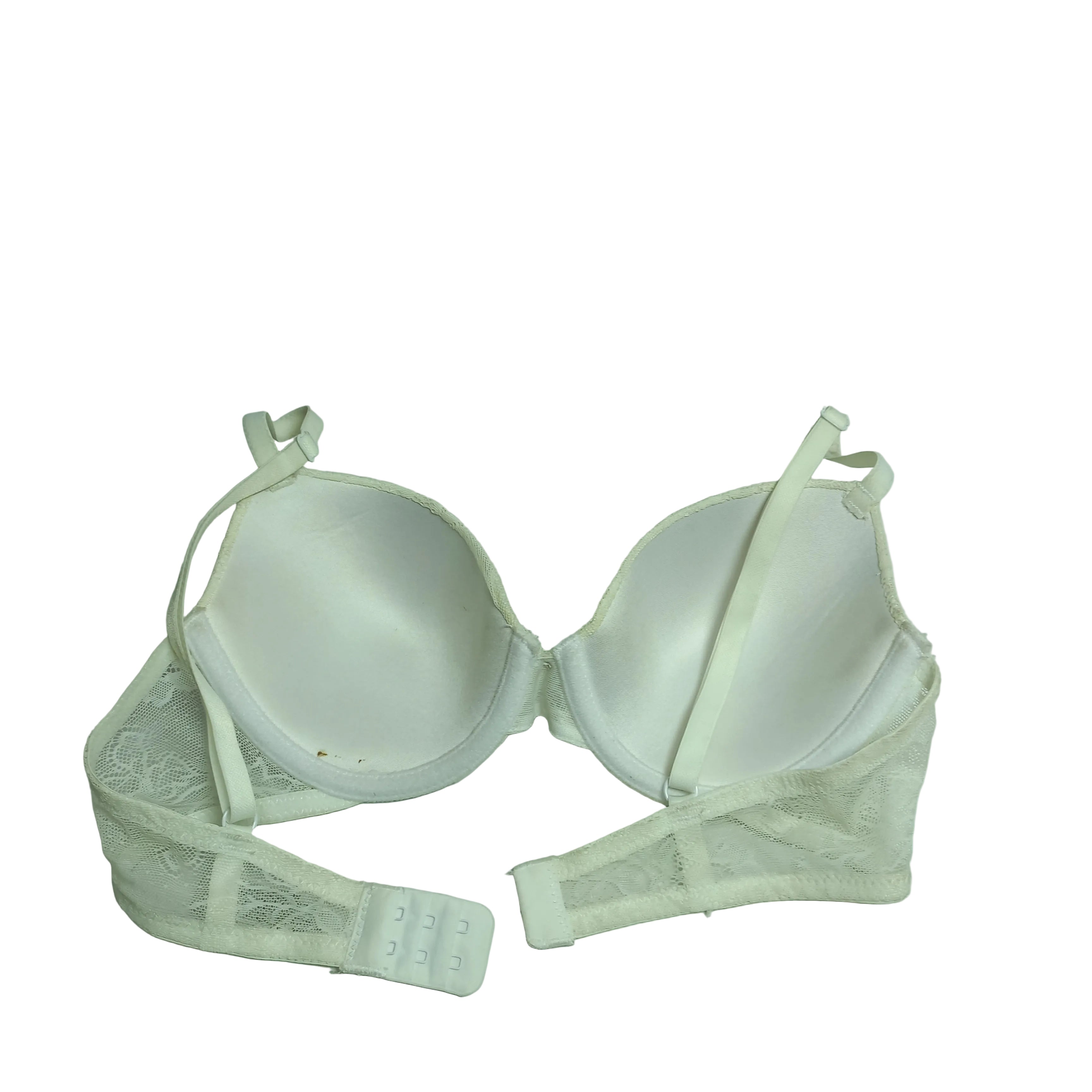 bra detail, lightweight white fabric, and seamless construction are visible
