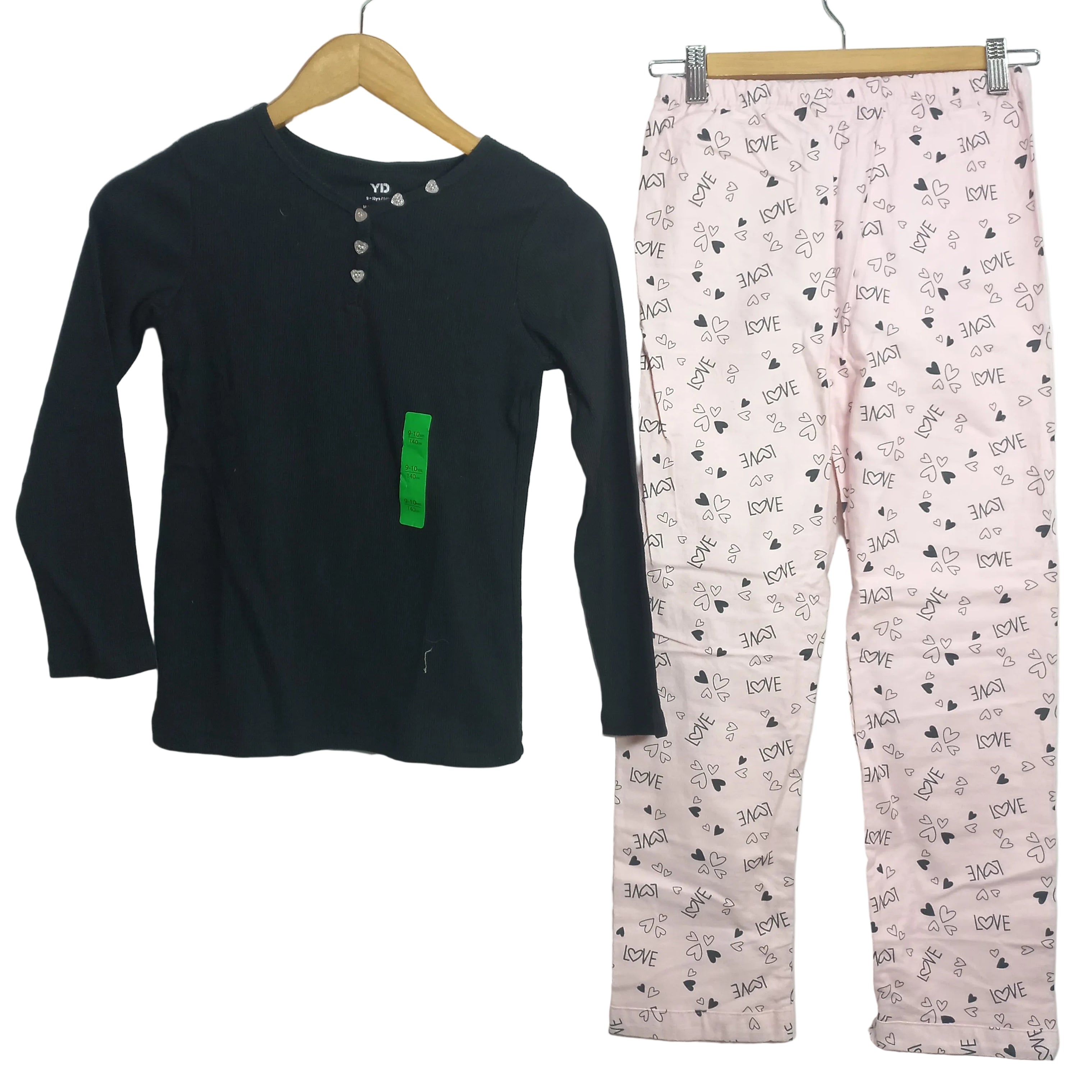 Primark girls pajama set in printed design shown front view
