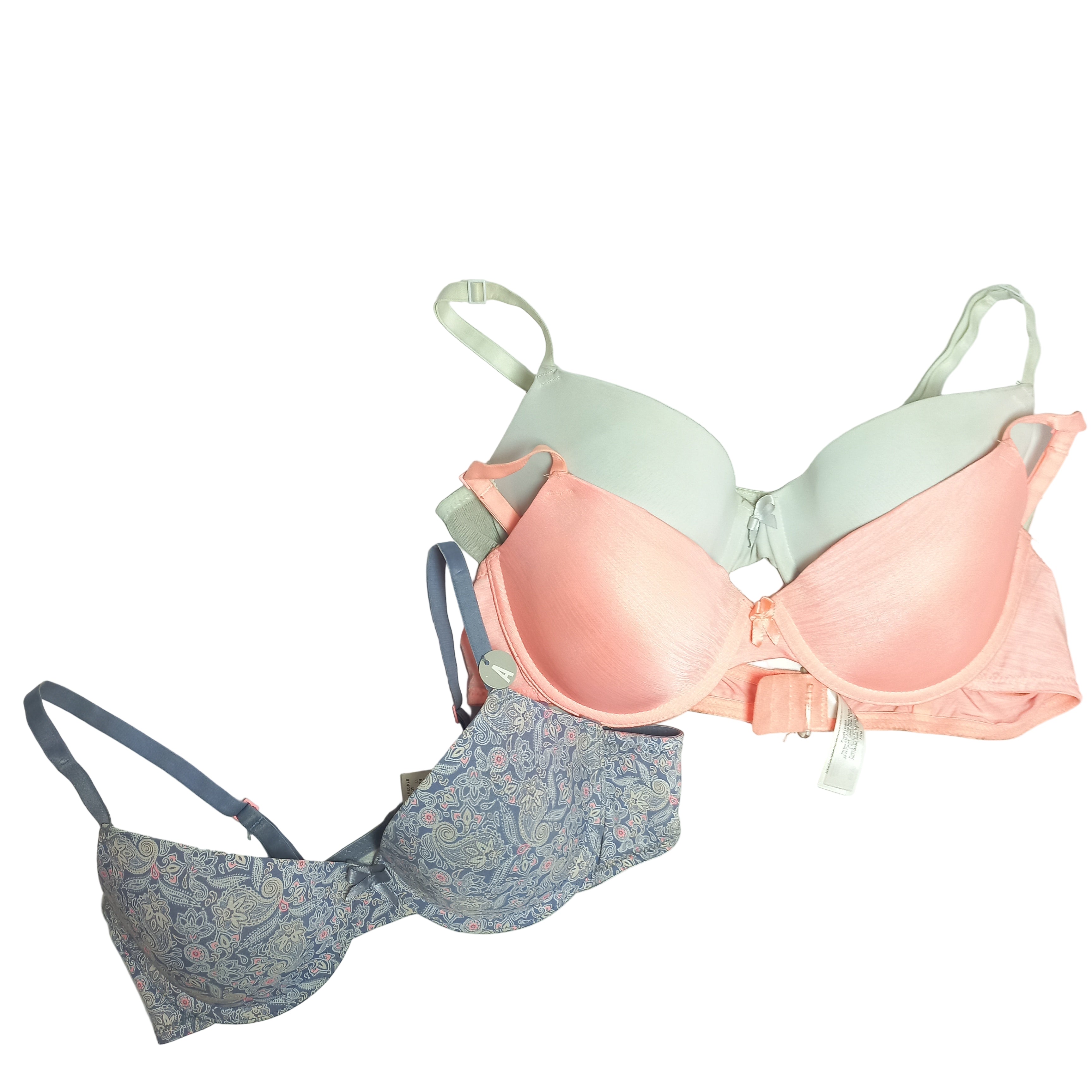 Set of three Primark bras in different styles and colors on a light gray background