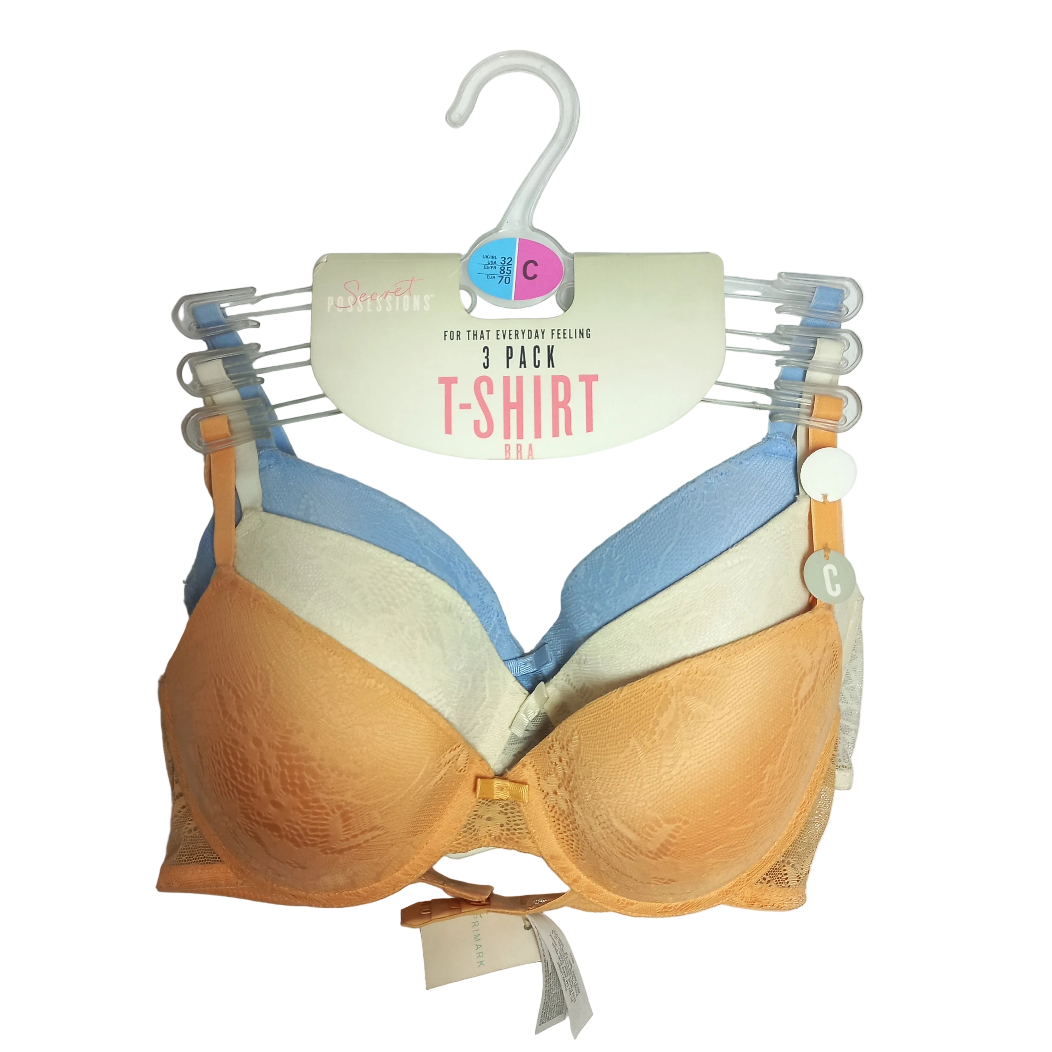 Three-pack of multicolored Primark T-shirt bras on a hanger with a visible brand label.