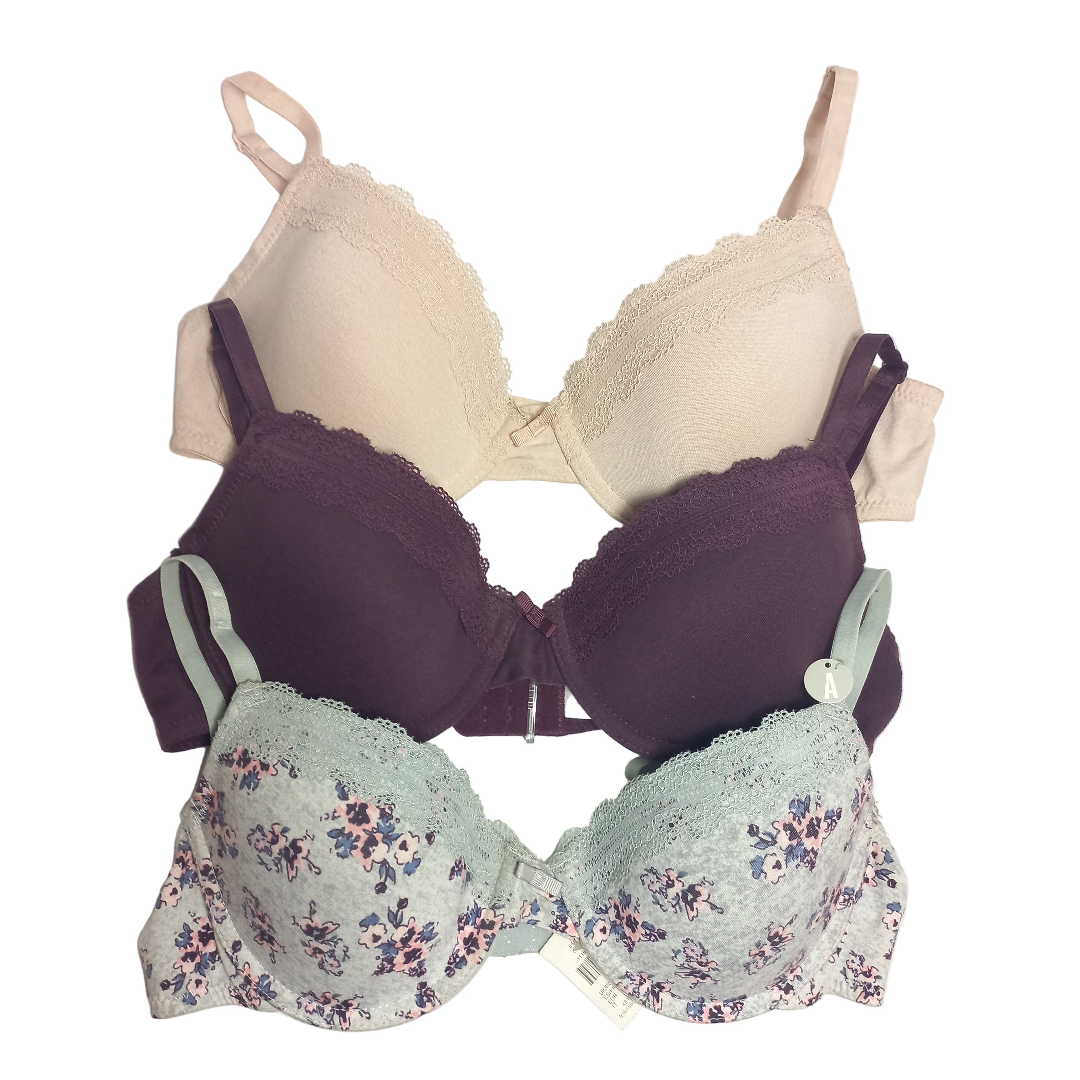 Three Primark T-Shirt bras in different colors on a white background