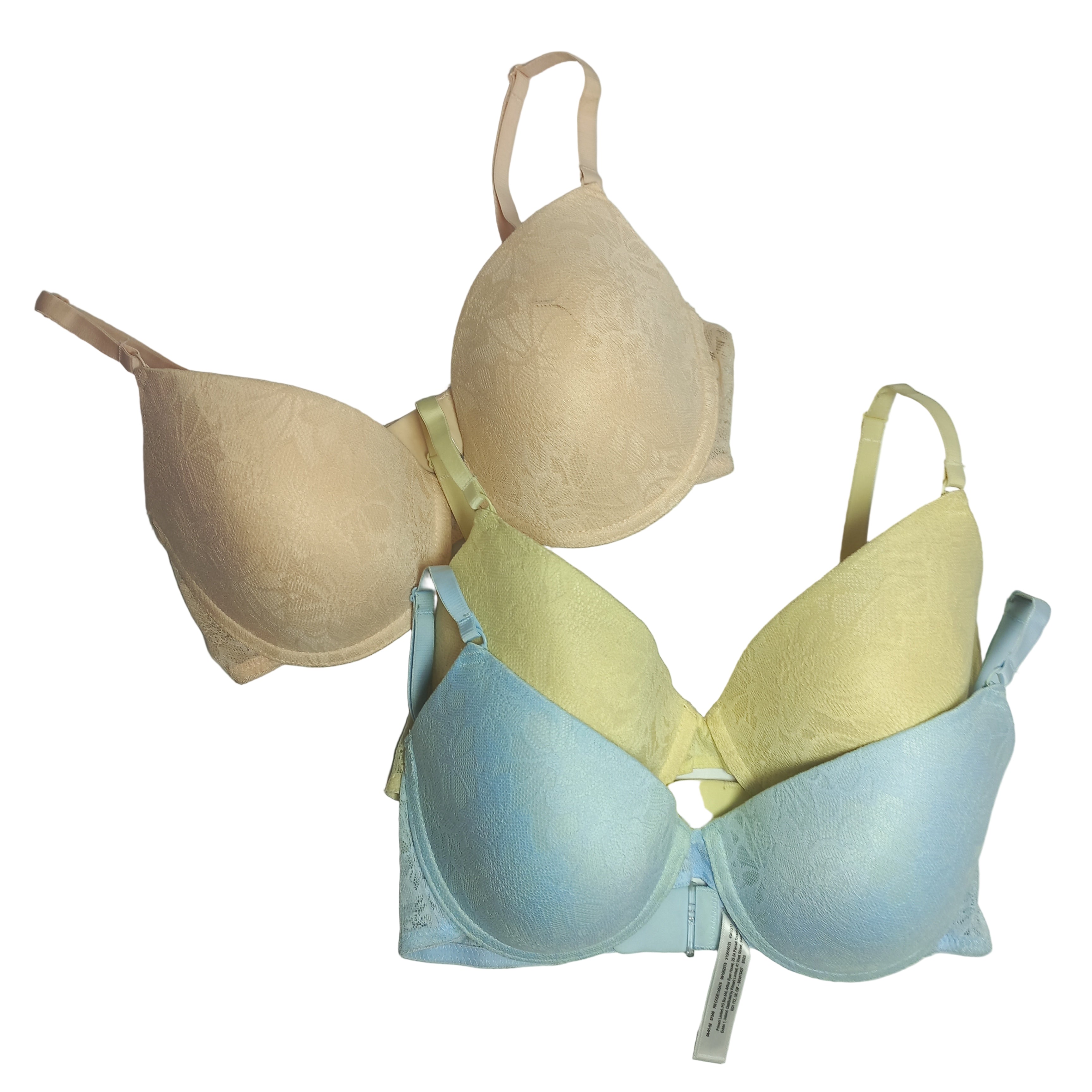 Three T-Shirt bras in beige, yellow, and blue on a light gray background