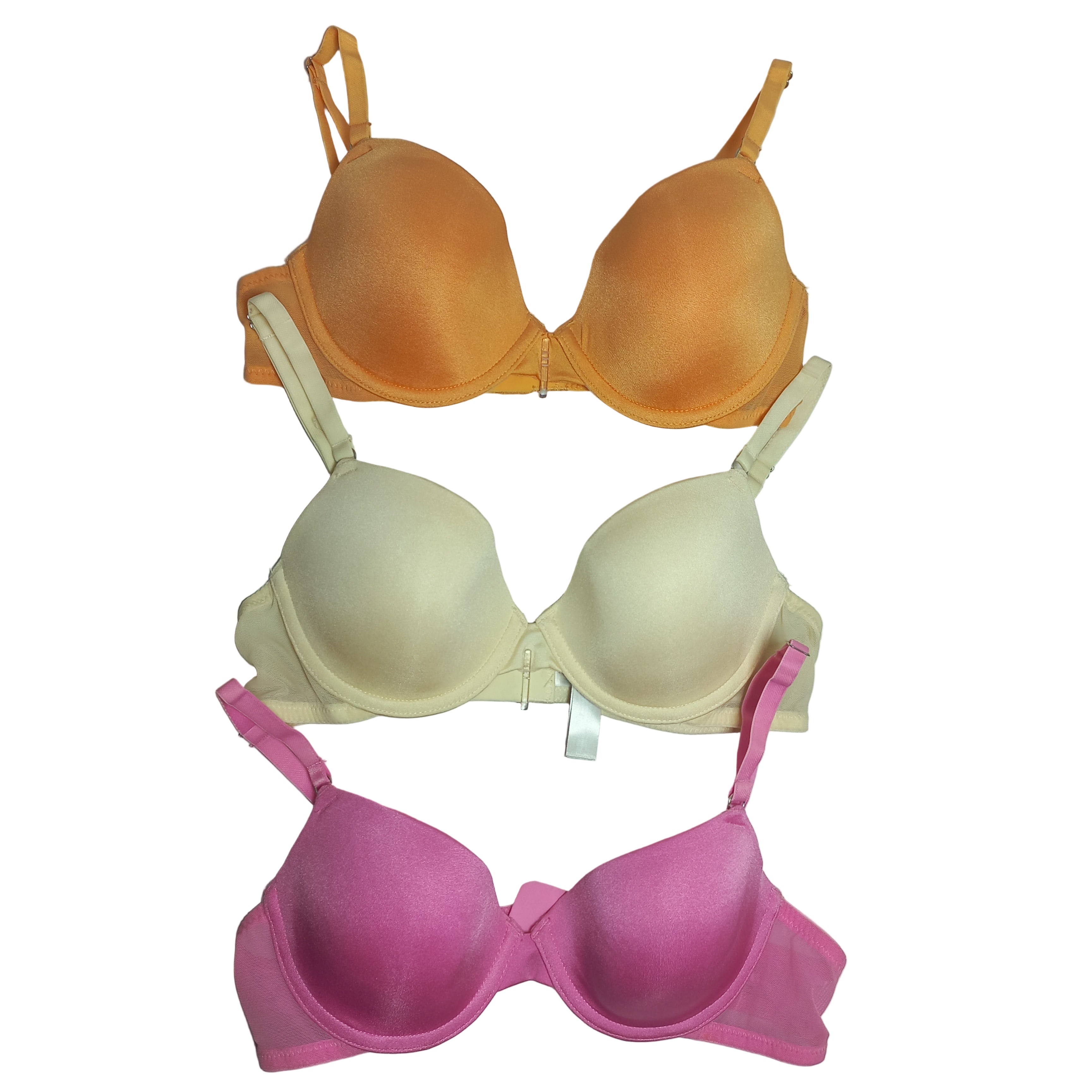 Three T-shirt Primark bras in orange, beige, and pink on a white background